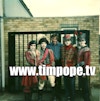 The Cure "Lullaby" - Tim Pope with the band at studio gates, Battersea, from a Polaroid.