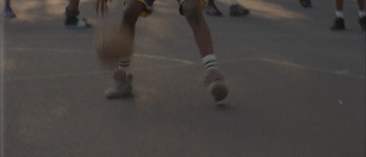 As the sun begins to dip behind the trees, the energy of the players racing up and down the vibrant blue basketball courts on Ducketts Common remains upbeat.
Sitting between the courts is head coach Hesketh Benoit, a beacon of calm among the loud shouts, cheers and bouncing basketballs, who oversees the Haringey midnight basketball sessions. They are one of 49 projects to have benefited from £400,000 of funding from Sport England in recent months, aiming to help tackle serious violence and knife crime by providing positive activities after school when young people are most at risk of being drawn into violence.