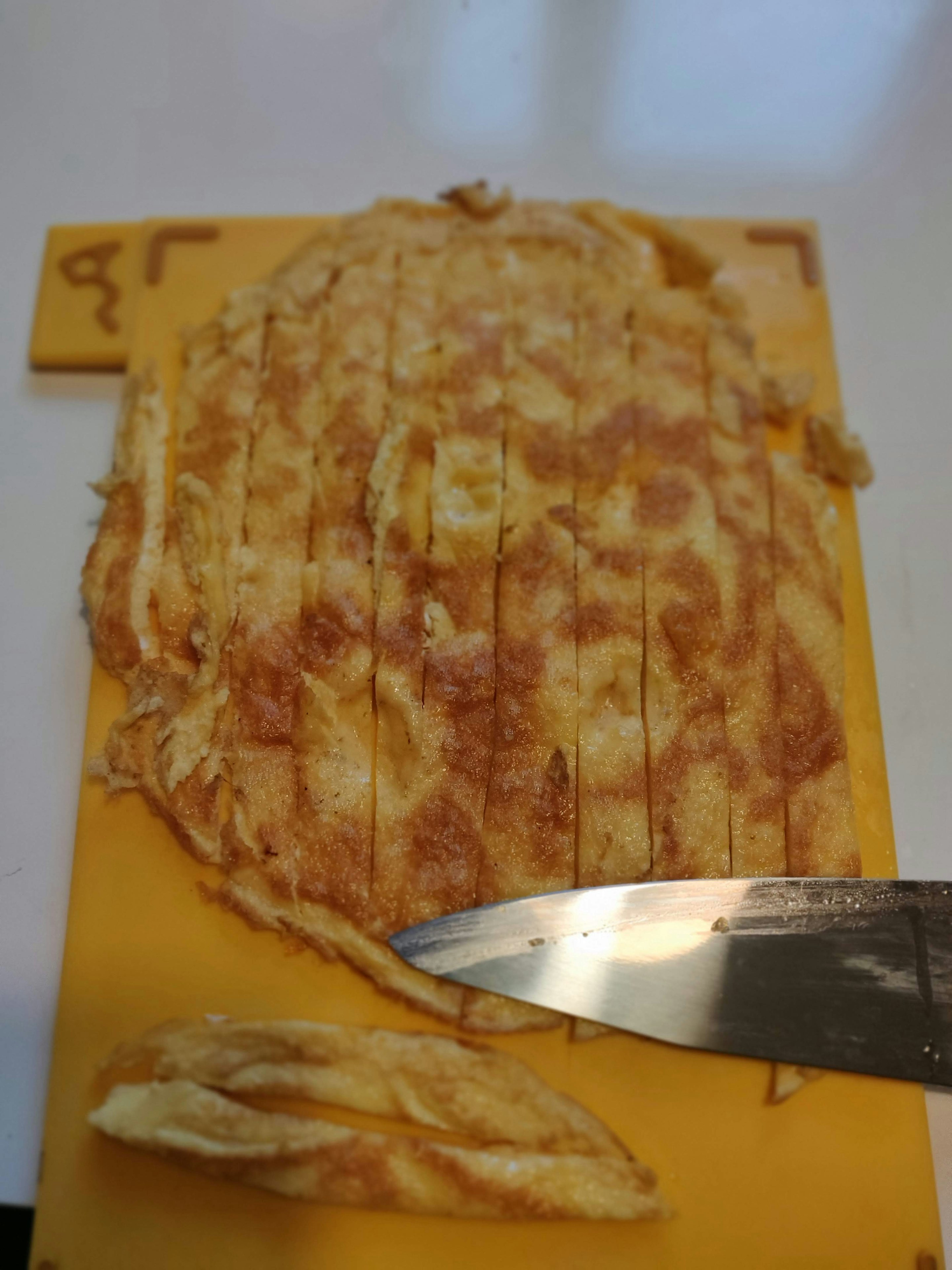 Thin slice the omelette