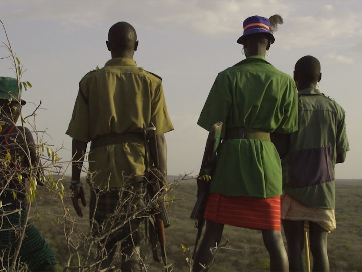 The four main rustlers followed in the film - Kaluca, Akasowian, Lomunyo, and Tuliangura look over their territory in the bad-lands of Pokot.