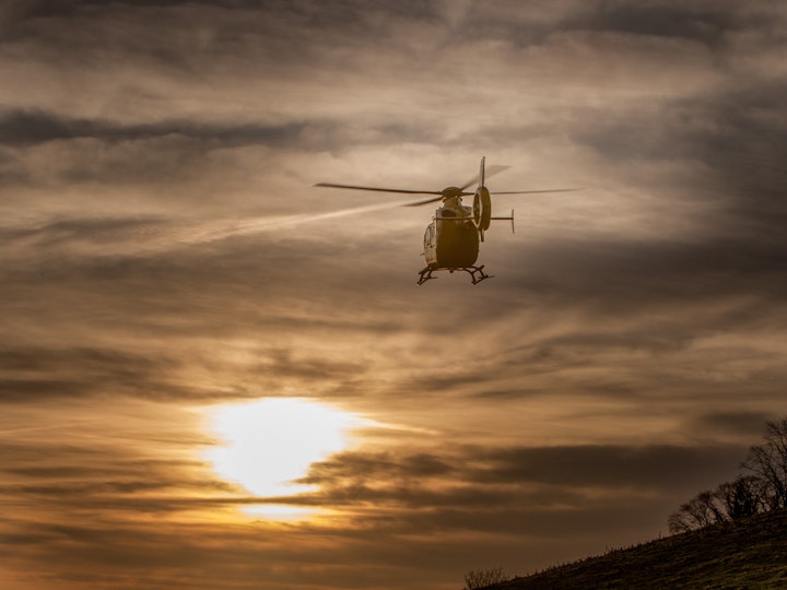 The North West Air Ambulance lifts out of Kendal as the sun rises.