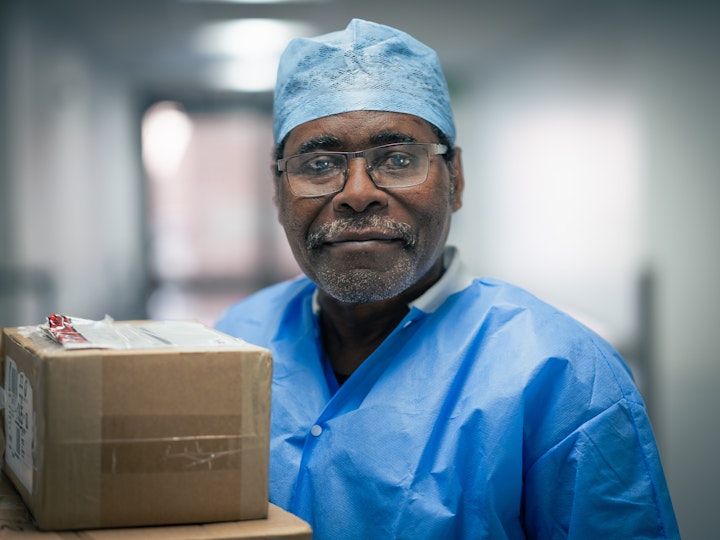 Open Britain x NHS Imperial Trust Collaboration - Albert King – decontamination supervisor in the endoscopic processing unit, Hammersmith Hospital
Albert King was born in Kinshasa in the Democratic Republic of Congo. He came to study in the UK in the early ‘80s.
After studying English at Abbey Missionary School in London, he went on to study theology and religious studies at the University of Cambridge. During an open day at the Addenbrooke’s Hospital, Albert became very interested in surgery and theatre. He was drawn to working in a hospital and ‘saving lives, seeing people coming in sick and leaving healthy’. He trained and qualified as a medical decontamination technician, and was then assigned in theatres to reprocess the medical-surgical devices and theatre equipment making sure they are decontaminated and safe for surgery.
Albert works at Hammersmith Hospital Monday to Thursday and from Friday to Sunday he works as a religious minister at Elim Community Church – moving between both physical and spiritual wellbeing.
