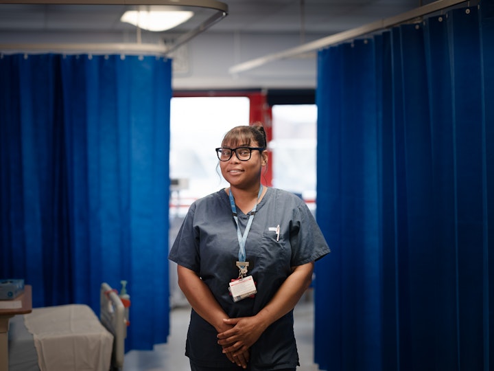 Open Britain x NHS Imperial Trust Collaboration - Ruth Lindsay -– sSenior sStaff nNurse/wWard sSister on Charles Pannett ward, St Mary’s
Ruth Lindsay was born in Negril, Jamaica. She came to the UK aged eighteent 18 year oldeighteen to study and visit relatives.
She initially studied social work and spent two years working with children, but said it ‘that felt more like policing than caring’. Ruth decided her real calling was as a nurse. DuringAs part of her post-graduate nursing degree, Ruth did a placement on the Charles Pannett Ward at, St Mary’s Hospital and jokingly recalls that it was not an experience that she particularly enjoyed. She jokingly remembers it not being an experience she particularly enjoyed or a place she wanted to work.
When Covid-19 hit, Ruth had one more placement to complete her degree. In a time of national emergency, the gGovernment decided to give student nurses the option to be on the front -line. Ruth grabbed it and found herself back onin Charles Pannett Ward. ‘Different and challenging times’ led to a different experience and soon after she was offered a permanent position. Three years later she’s still there and loving it.