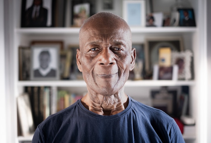 Open Britain: Portrait of a Diverse Nation - Rudy William Agard was born in Barbados in 1941. He went to school til fifteen then worked as a gardener at a hotel followed by a stint on a sugar cane plantation. At this time he developed a passion for body building. Both his parents passed when Rudy was young. He’s not sure what took his mother but his father’s death was alcohol related.
His Uncle, the spit of Rudy. “`If you’d see him, you’d see me”, was in the UK and sent for him in 1961. He lived where the Trellick tower now stands. It was hard to start with, ‘I was in a strange place both mentally and physically’. But Rudy learnt to adapt.
His uncle got him a job with British Rail as a carriage cleaner. It was still steam-engine days when he started. He remembers working in the coal storage department and still having to blow the soot out of his nose weeks later. Rudy was a cleaner for 10 years before Fred Stevens, Rudi gratefully remembers his name, gave him an opportunity. He became a charge-hand, then a supervisor and then a manager. He tried to retire at 65 but was bored and back to work. Rudy gave 47 years of service to British Rail.
Rudy met all sorts. ‘Everybody’s not the same, some people liked us and some people didn’t’. Rudy remembers one worker refusing to take orders because of the colour of his skin as well as having to walk away from numerous confrontations despite his physical ability. Rudi has become more philosophical with age; he imagines if such large numbers had come to his island of Barbados he also might not react that well. He places a lot of blame on the government not preparing people back then, “It’s like me inviting you to my house and not telling my wife and kids what I’m doing. When you turn up, they’d ask ‘Where did he come from? Why is he here?’.”
I met Rudy at my local gym where he still goes 6 days a week. It is a pass-time that has given him so much. Baring in mind the challenges he faced and the history of alcoholism in his family, it almost certainly helped keep him on the straight and narrow.