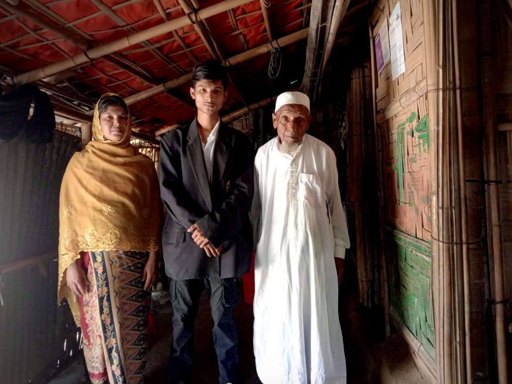 Korim Ullah (middle) with mother and grandfather.