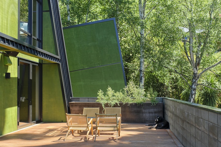 The Black House part two - Jack the dog enjoys his favourite summer spot on the deck at the black house in Queenstown