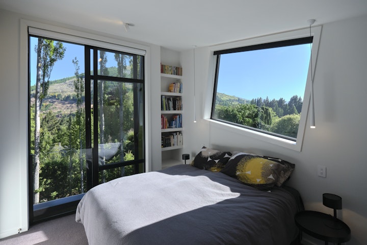 The Black House part two - The primary bedroom at the black house in Queenstown was designed by Architect Stacey Farrell to capture sunlight and views of the surrounding hills