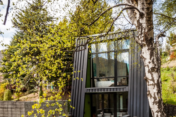 The Black House part one - Surrounded by trees the Black House part one complements the natural environment of Arthurs Point designed by local Architect Stacey Farrell