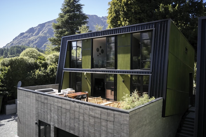 The Black House part two - The north facing deck in Arthurs Point captures all day sun for this Queenstown home designed by local Architect Stacey Farrell