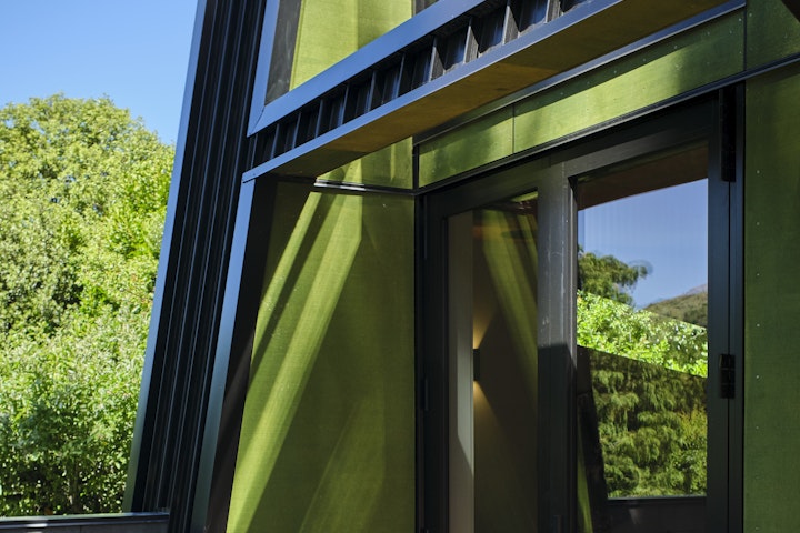 The Black House part two - The textured exterior walls reference the green nature and native trees at the Black House designed by Stacey Farrell in Queenstown