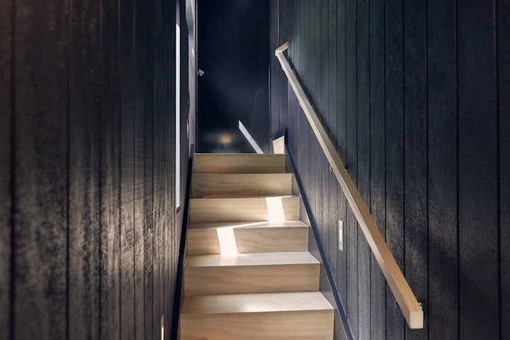 Stair detail with contrasting light by Stacey Farrell Architect