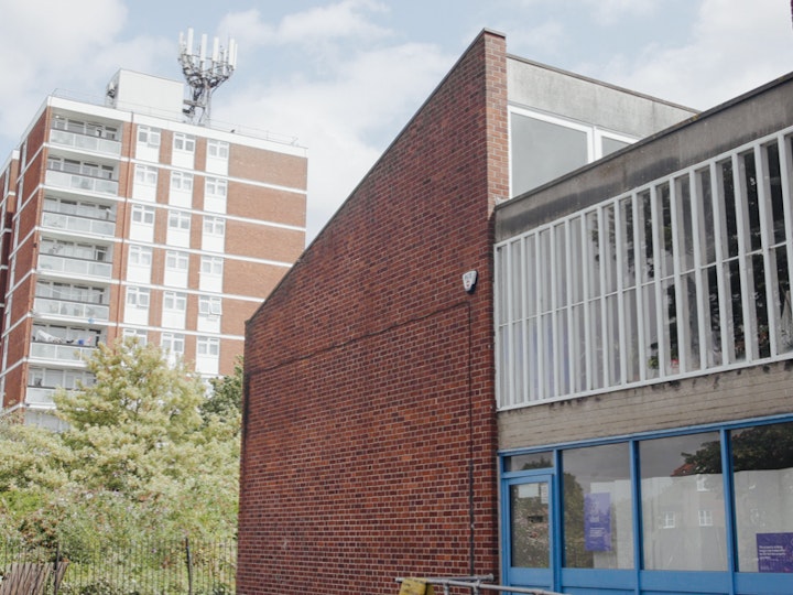 The Grove Park Youth Club with the high rise building of the Chinbrook Estate