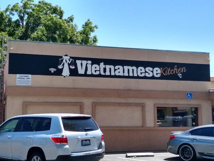 The restauranteur needed an additional sign so customers would know at a glance what he serves. He already had the name on a large sign, to the right of this part of the building.