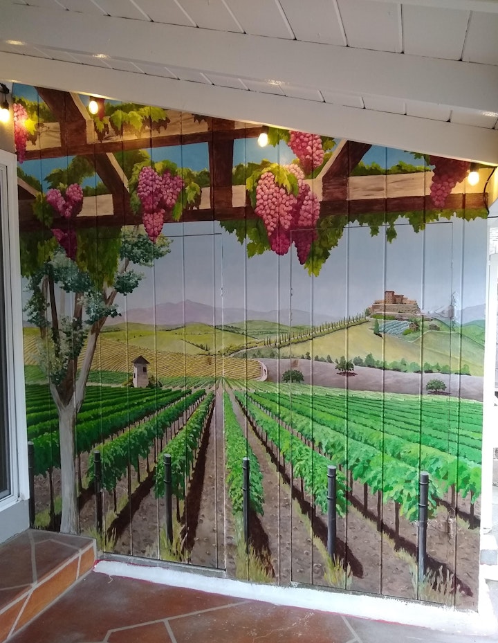 This wall is actually doors to a storage closet, at one end of a patio. The owner wanted to be transported to Napa whenever he came outside.