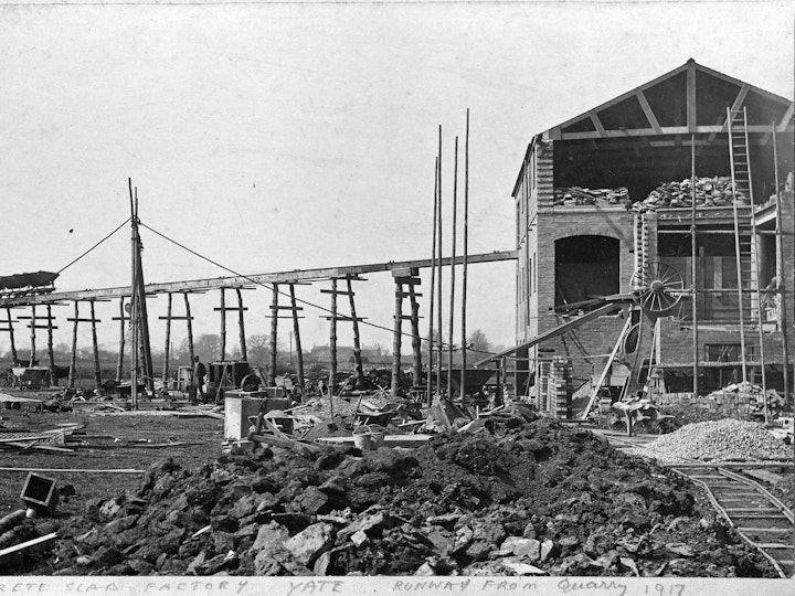 Murray Dowding photograph of the National Concrete Slab Factory adjacent to Yate Station complete, in particular its elevated tramway that transported stone from the nearby quarry to the south west of the factory.