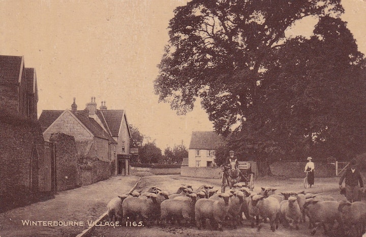 Winterbourne Village in Gloucestershire with the Swan Inn on the left and Watleys End Road on the right