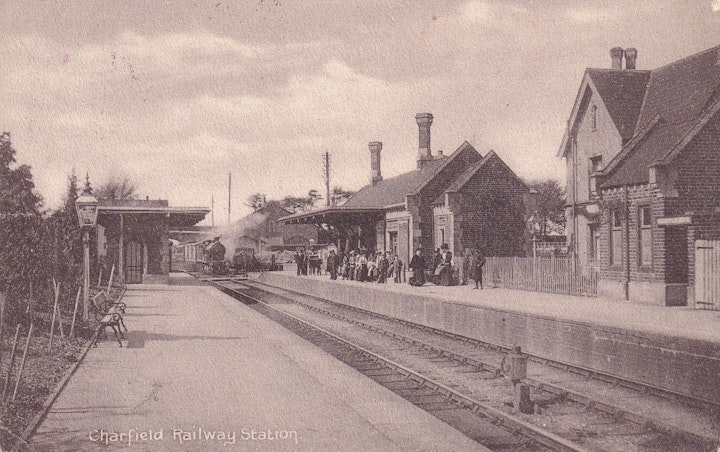 Charfield Railway station (Gloucestershire) posted in 1907 (The Cotswold Publishing company) with train approaching.