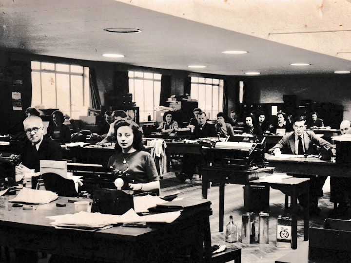 Photograph of Bob's late  brother Terry, in glasses in the centre of the picture, in the drawing office of Parnalls.