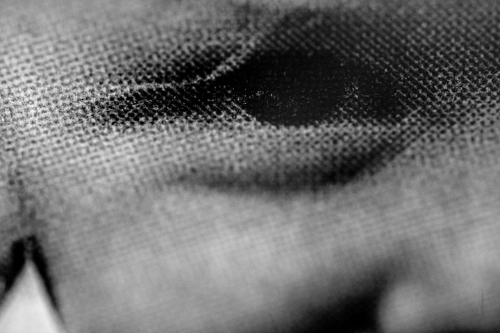 Macro super-closeup of a printed halftone in black and white.