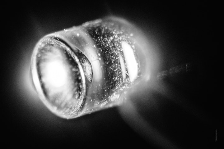 Macro super-closeup of an LED lamp in black and white.