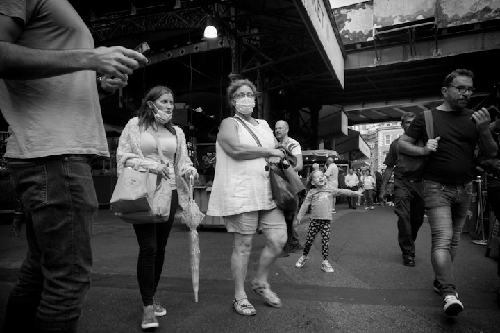 Street Folio I - Groups of people cross at converging paths in Borough Market, south London