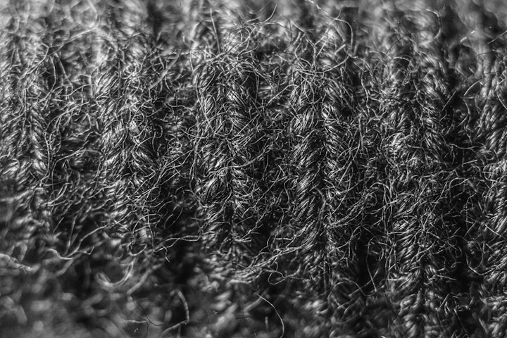 Macro super-closeup of knitted wool in black and white.