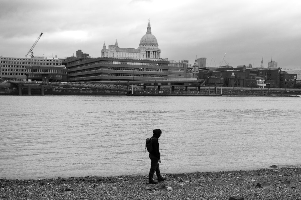 Street Folio II - A man on the Thames riverbank with St Pauls cathedral across the water