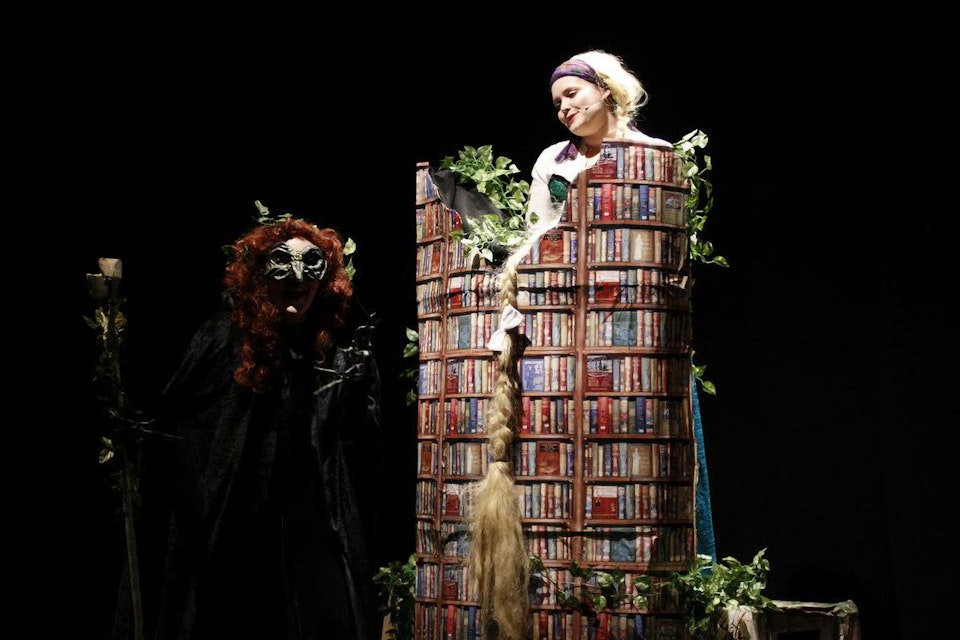 Into the Woods - Rapunzel's tower used patterned wrapping paper to suggest a tower built from books.