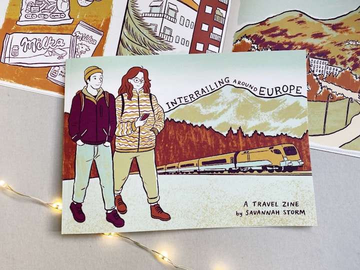 Travel Journal - Illustrated travel journal zine about adventures interrailing around Europe. The cover shows a couple walking along, with a train, a forest and mountains in the background.