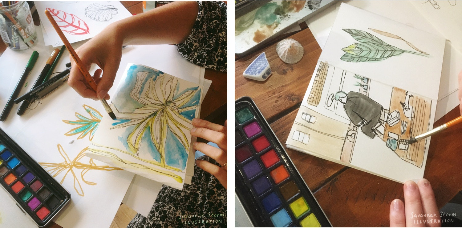 Two sketchbooks on tables being drawn into by hands holding paintbrushes. One is sketching a leafy plant, and the other is sketching a coffee shop scene.