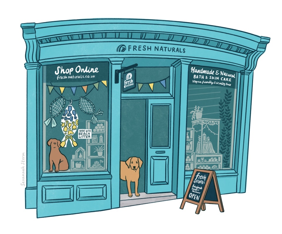 Shop Fronts - Illustration of a blue shopfront of a shop called Fresh Naturals, with recycled plastic beach litter displays in the windows and a brown dog standing in the doorway.