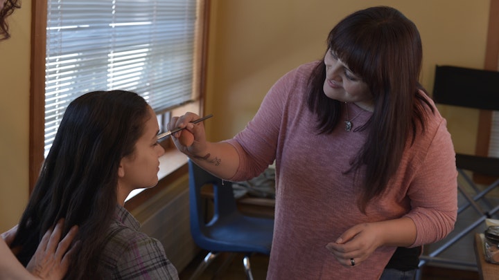 Make-up key artist Josie Rodriguez touches up Malala Pyle.