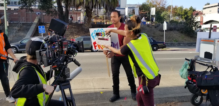 Super talented cinematographer Sherri Kauk with second AC Annie Li filming  with actor Cameron Matthews on the median in Oakland.
