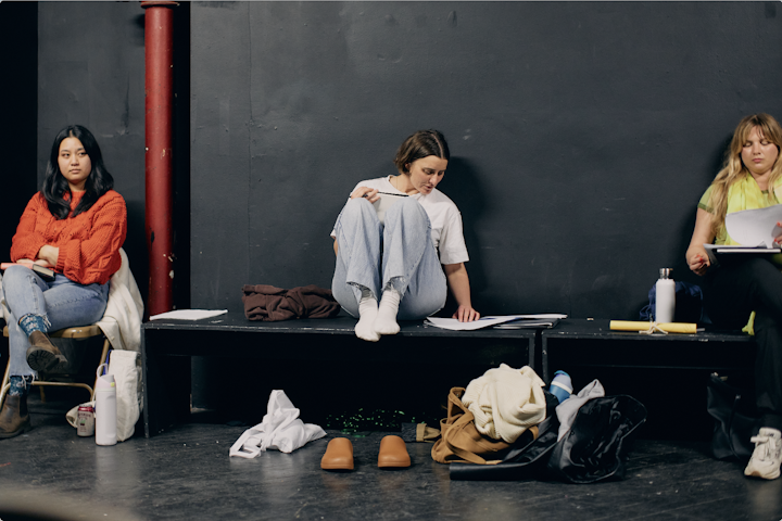 NEXT STOP - Sorting through my notes to talk through a scene during rehearsal.