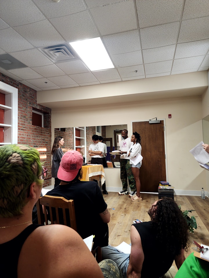 A DAY IN THE LIFE - Directing cast members during rehearsal.