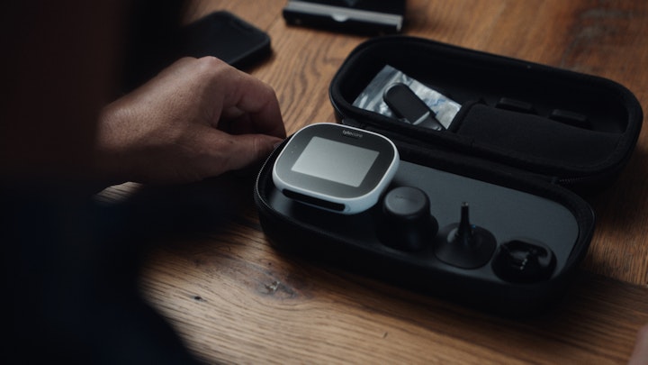 closeup of medical device laying on kitchen dining room table