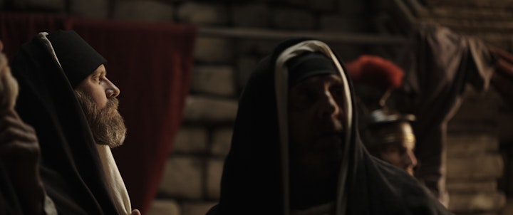 pharisees looking over at jesus in jewish temple set dramatic recreation