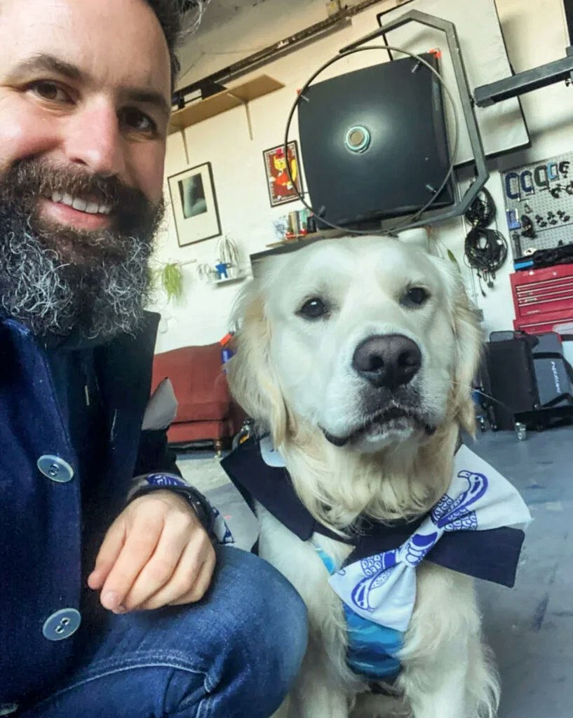 Scott Choucino and his dog teddy in matching outfits in their London food photography studio