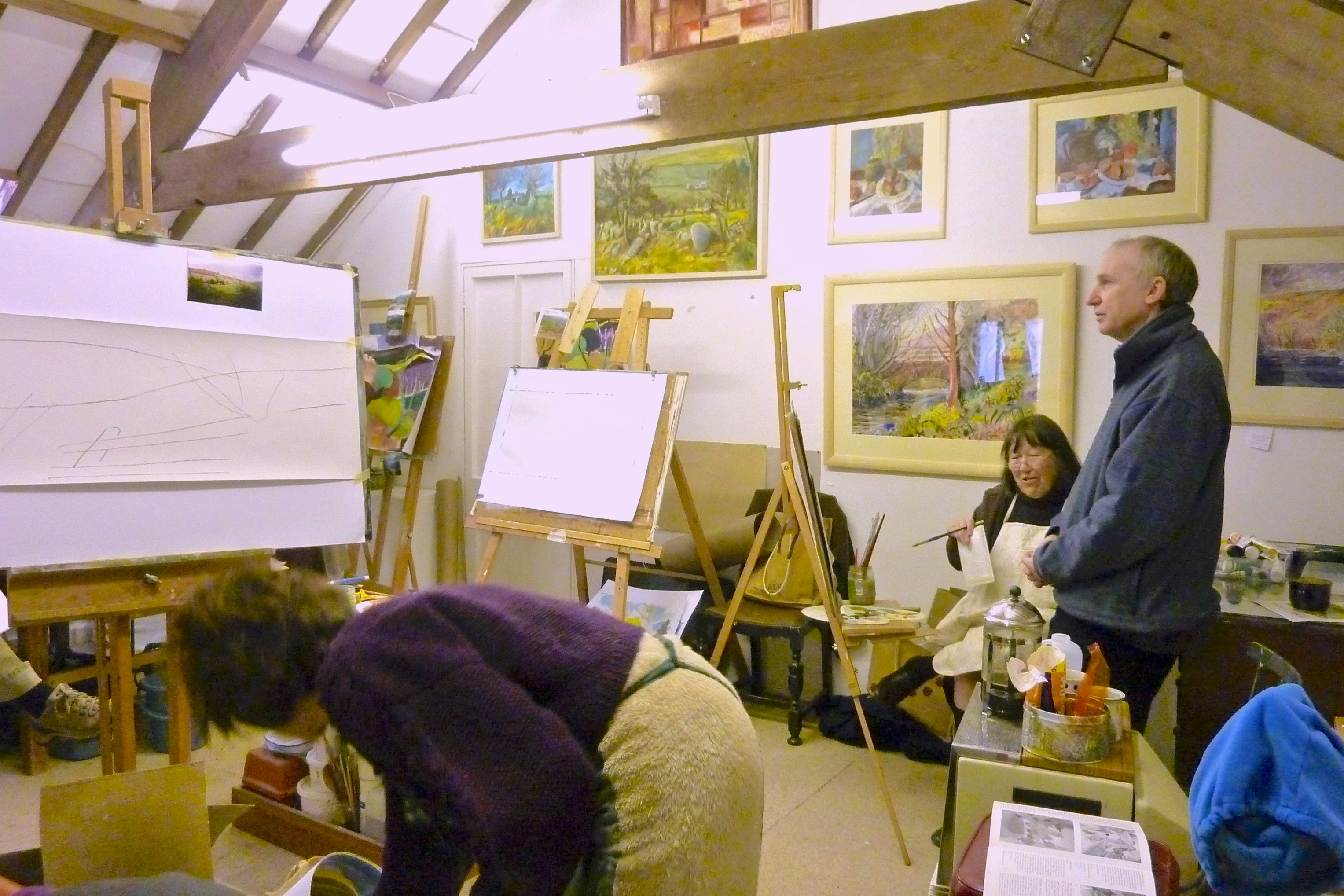 Interior of art teaching studio with three persons