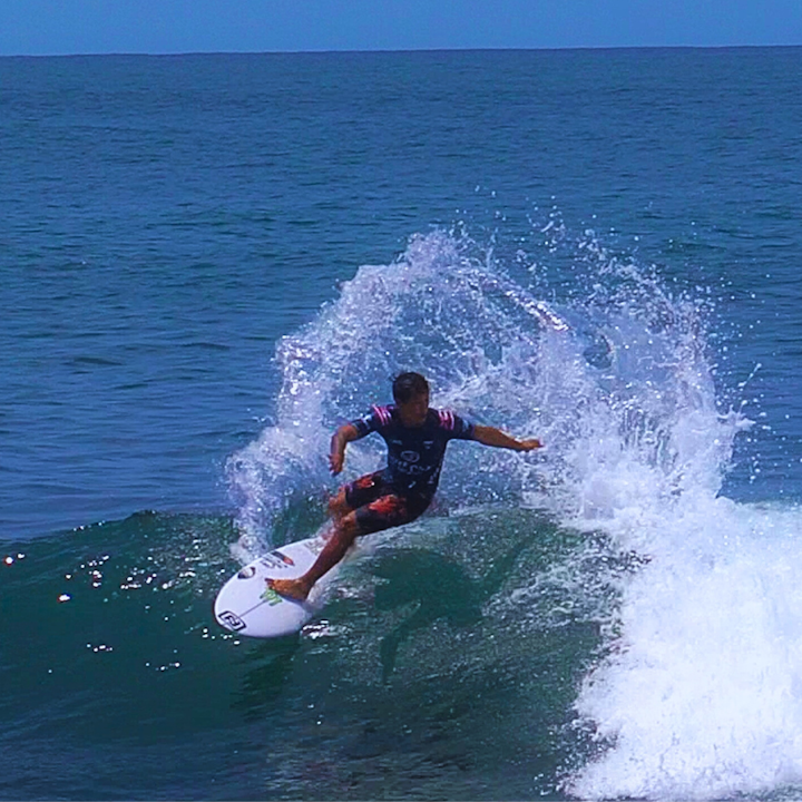 Surfer riding wave during the 2024 world championships.