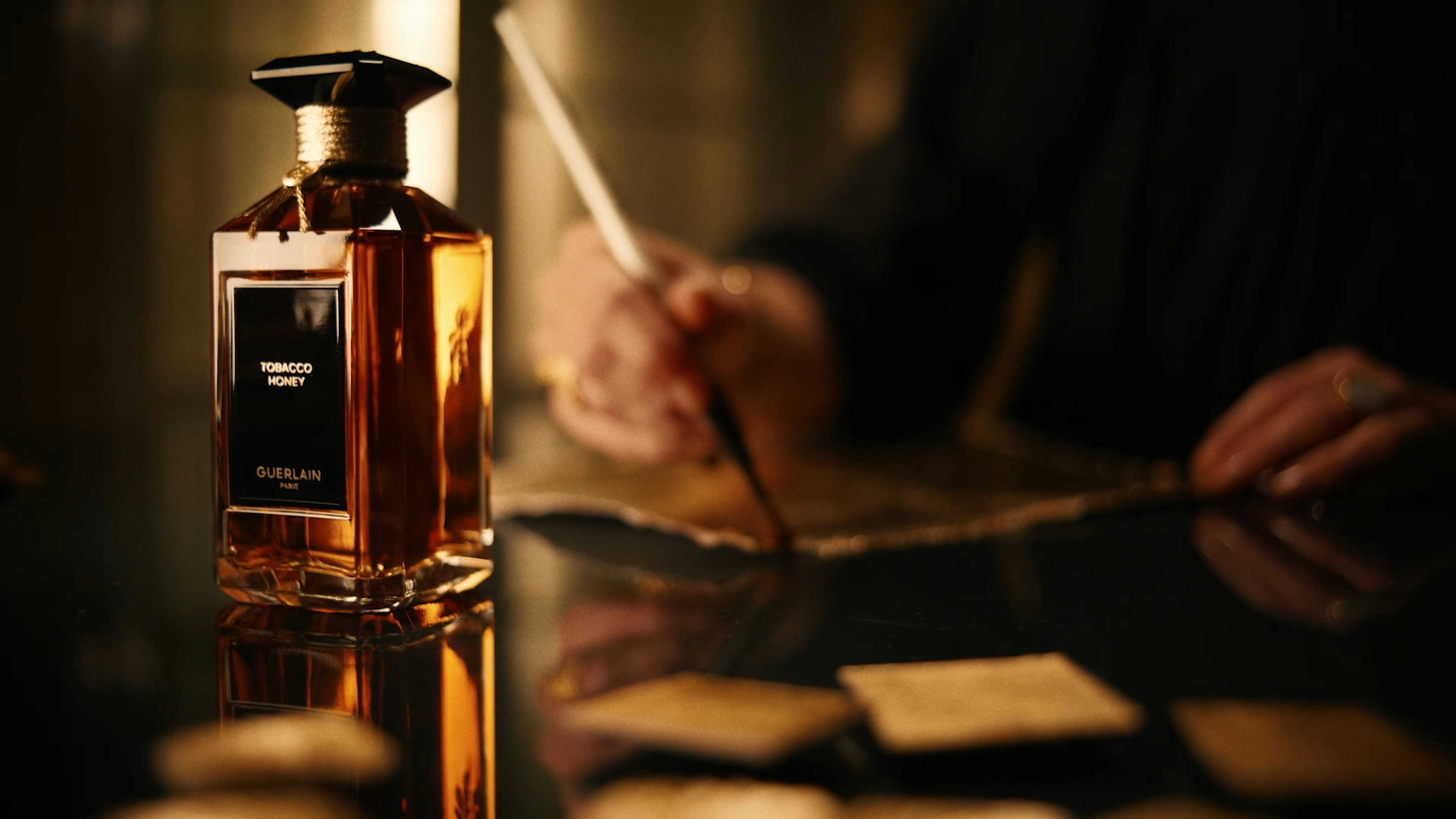 guerlain perfume honey tobacco L'Art & La Matire Eau De Parfum this scent wraps the wearer in an opulent embrace that balances gourmand sweetness with smoky sophistication Sweeter than Honey: Tobacco Honey