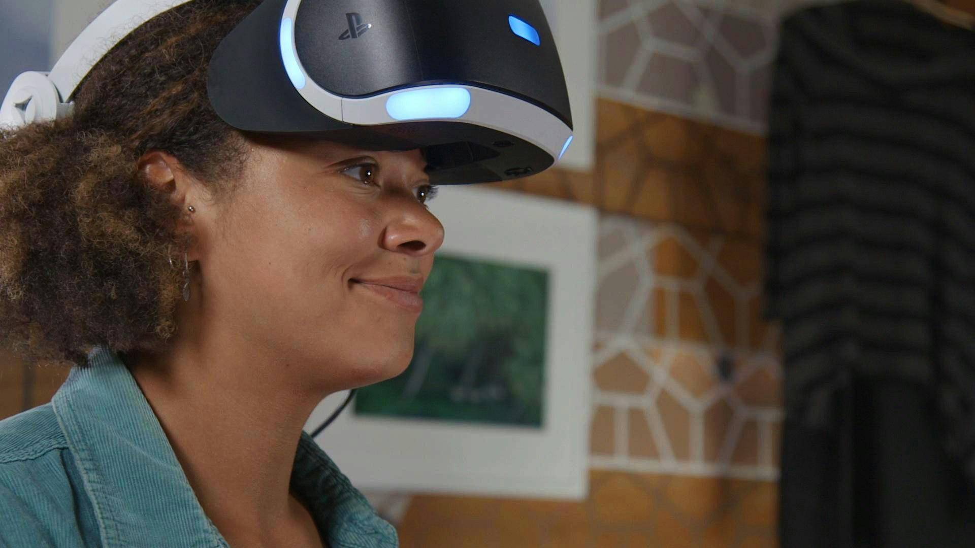 Actor Genny Turay receiving direction from Big Egg during the Futurlab trailer shoot, wearing Sony Playstation VR headset