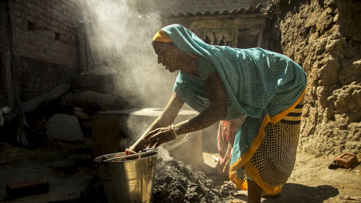Early morning. Women prepared cooking on a chulha, a traditional stove heated by firewood or dry cow dung cakes.
It is commonly used for cooking and heating food in rural households.