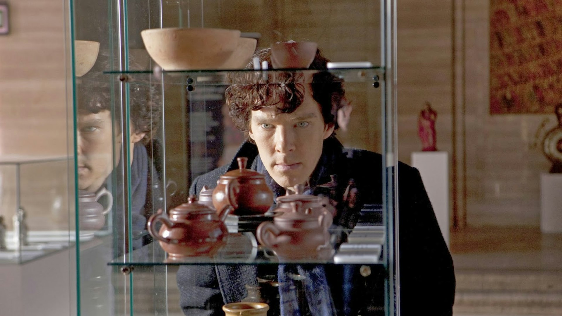 Benedict Cumberbatch as Sherlock Holmes studying Chinese Ming pottery in BBC Sherlock Season 1 Episode 2 The Blind Banker
