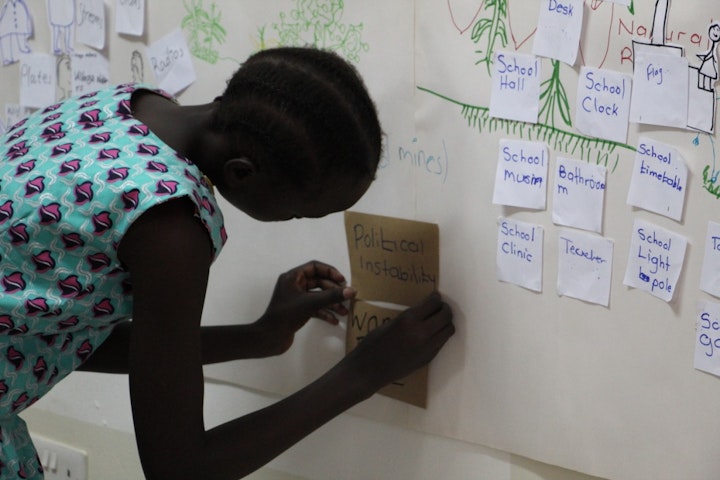 The group was asked to identify the various barriers that prevent girls from getting an education. Photo Josie Gallo