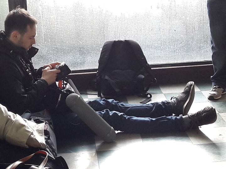 Production: The Light; Urban Chronicles, episode 1 - Day 2: Sound-man Theo Wyzgowski enjoys some downtime on his phone between set ups..