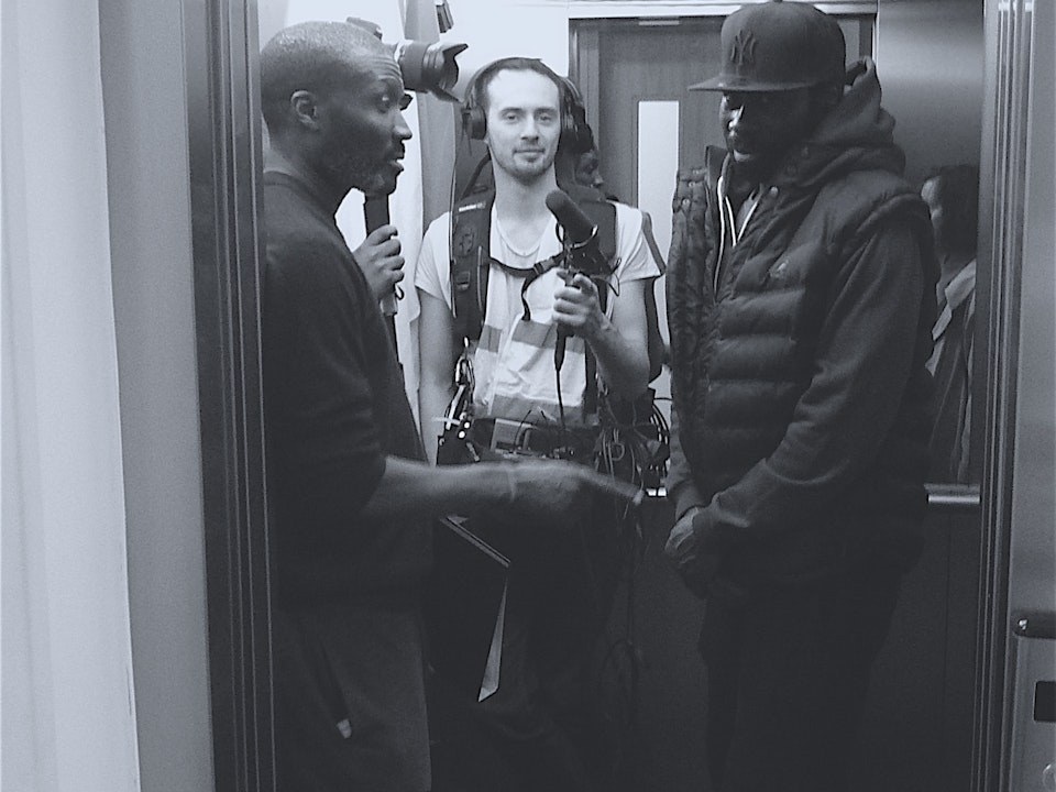 Production: The Light; Urban Chronicles, episode 1 - Day 1: Dir. J Bunting Johnson discusses a shot with Terence Anderson, as sound-man Theo Wyzgowski connects with photographer Angeline Hadman.