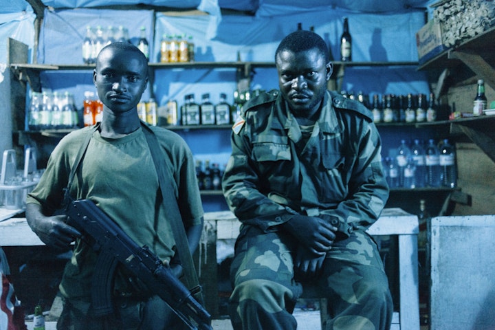 FARDC soldiers in a bar at night. Masisi.