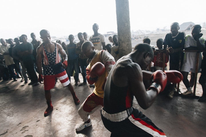 Kibomango and two of his boxers. Goma.