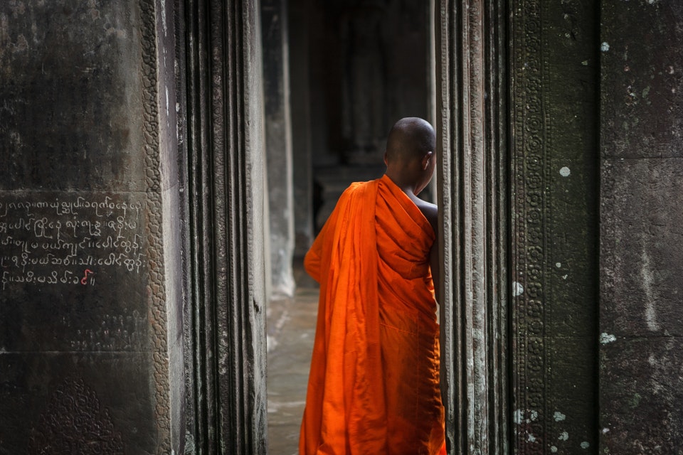 Buddhist Monk among stone temples, Angkor Wat